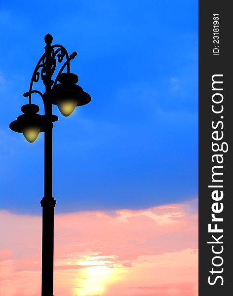 Lamp post against sunset background