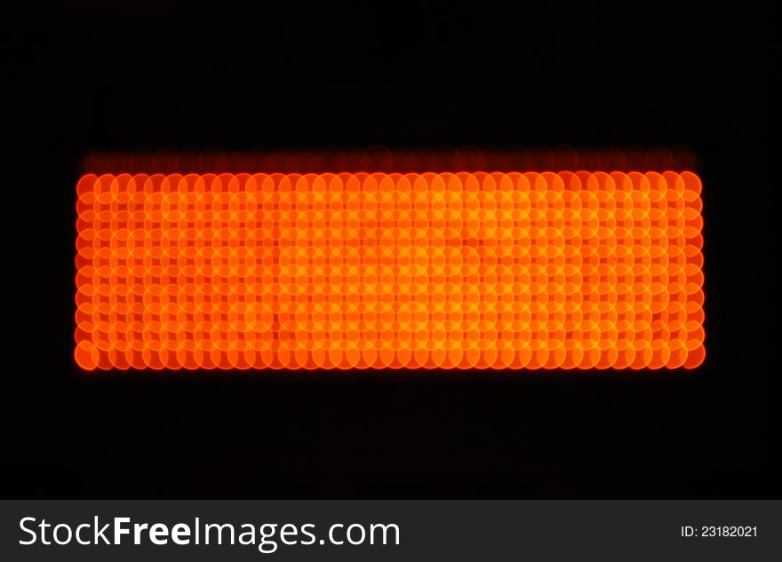 Defocused pattern of orange color colour lights. Defocused pattern of orange color colour lights