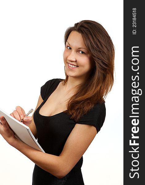 Girl with a notebook and pen on a white background. Girl with a notebook and pen on a white background