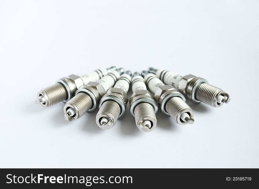 Group of auto spark plugs on white background. Group of auto spark plugs on white background