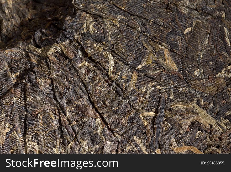 Close photo of a puer green tea cake. Close photo of a puer green tea cake.