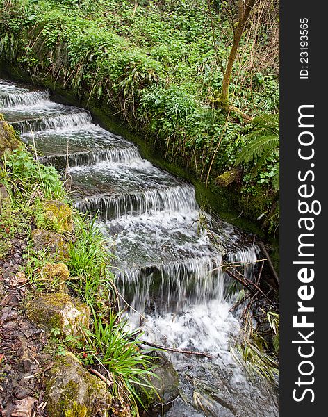 Cascade of water in Brockhill Park, Hythe, Kent