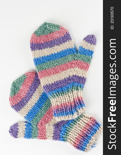 Bright, colourful handmade wool mittens on white background. Bright, colourful handmade wool mittens on white background