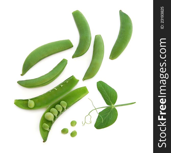 Pea vegetables with pods and leaf sprigs over white background. Sugar snap variety. Pea vegetables with pods and leaf sprigs over white background. Sugar snap variety.