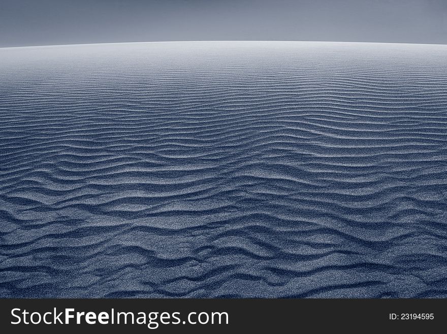 Close up image of wave patterns in sand dune after sunset. Close up image of wave patterns in sand dune after sunset.