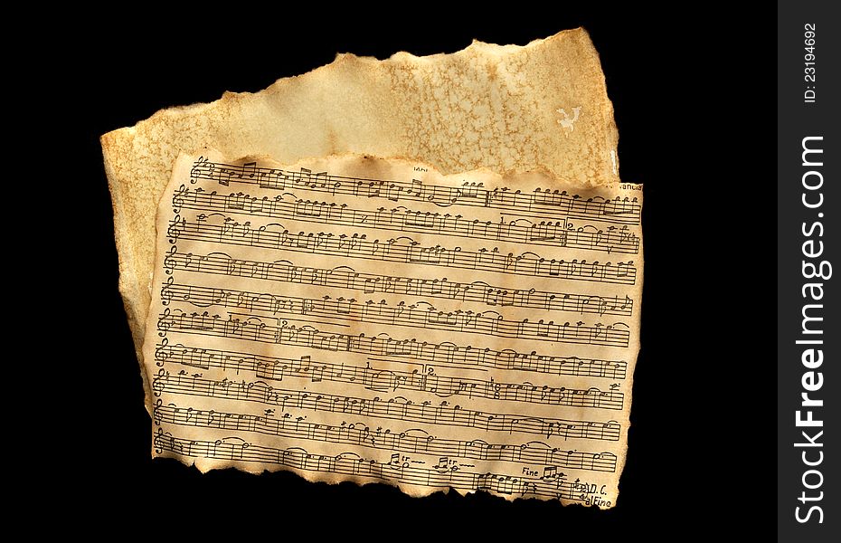 Old music sheet and parchment over black. Old music sheet and parchment over black