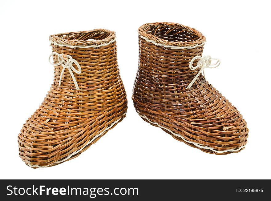 Decorative  wicker shoes on  white background