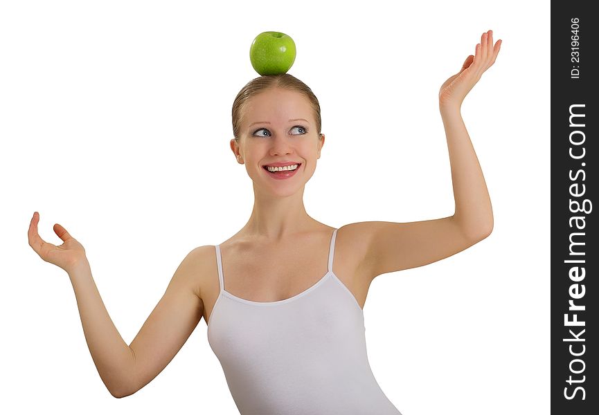 Funny girl balancing on her head with an apple