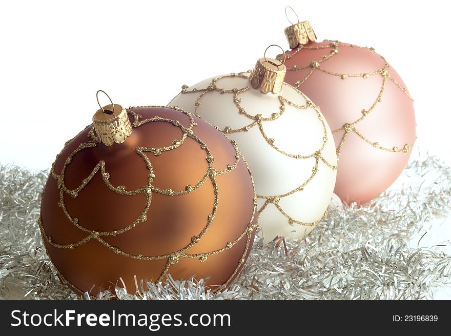 Triad round Christmas decorations on white ground