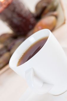 A Cup Of Hot Tea With Stones Stock Images