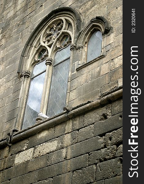 The old church window with white dove siting on the window sill