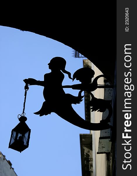 The silhouette of street lamp in form of mermaid. The silhouette of street lamp in form of mermaid