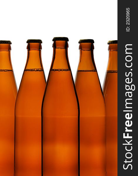 Beer bottles close-up isolated over a white background