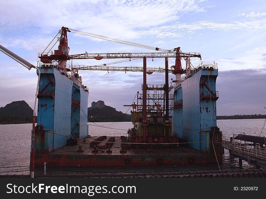 A floating dry dock carrying a barge. A floating dry dock carrying a barge