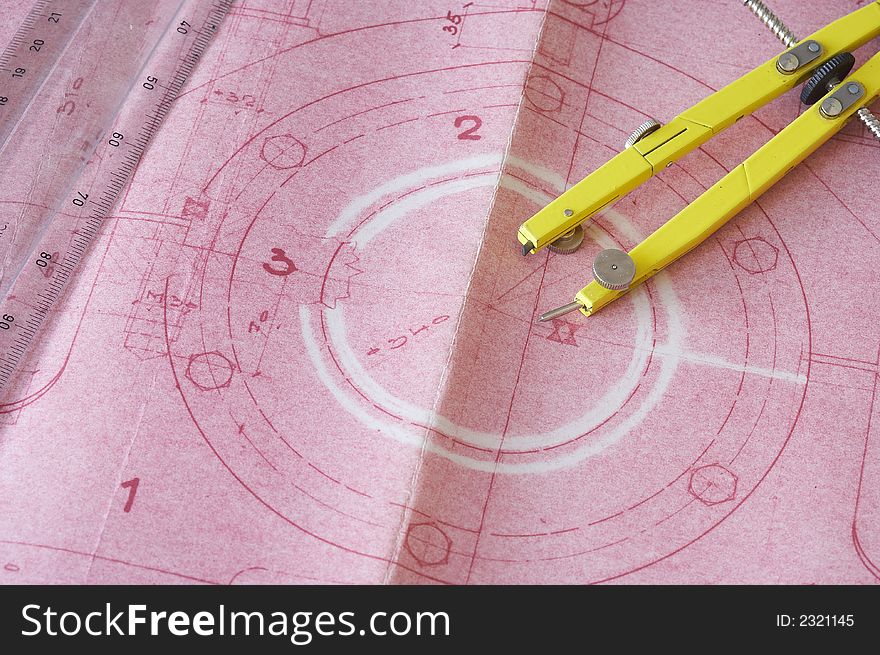 Pink engineering drawing on drawing desk with ruler. Pink engineering drawing on drawing desk with ruler