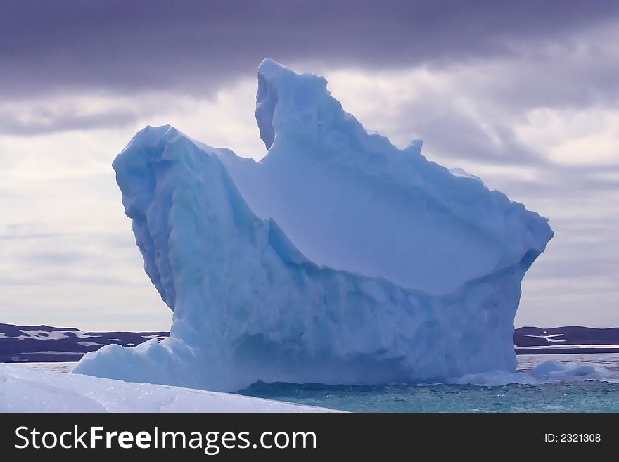 Huge iceberg floating in the sea