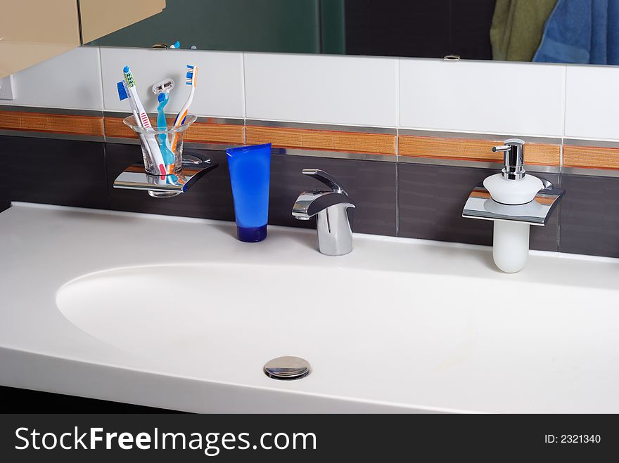 Interior of modern bathroom with sink, tap and accessories. Interior of modern bathroom with sink, tap and accessories