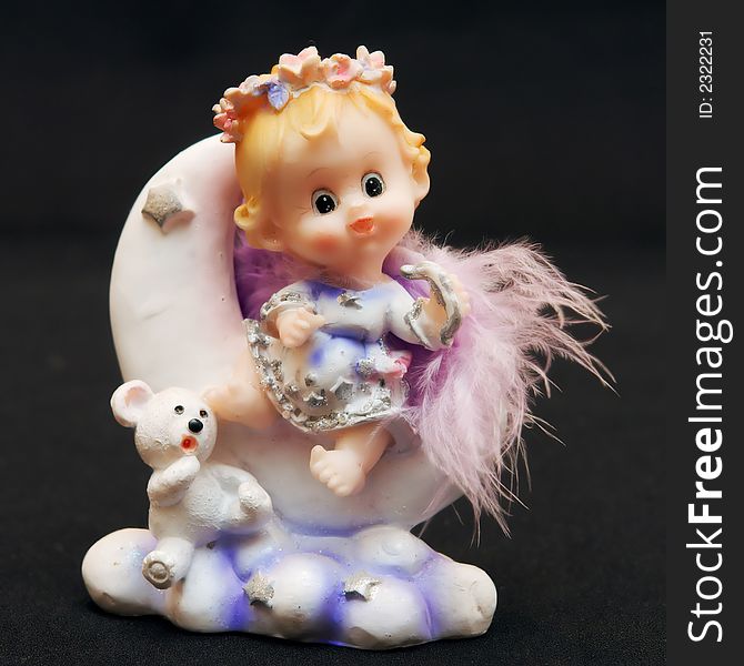 Small toy angel as a souvenir for an ornament. Small toy angel as a souvenir for an ornament
