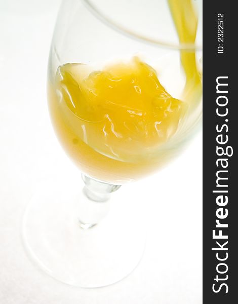 Wineglass with orange juice, liquid, closeup. Wineglass with orange juice, liquid, closeup