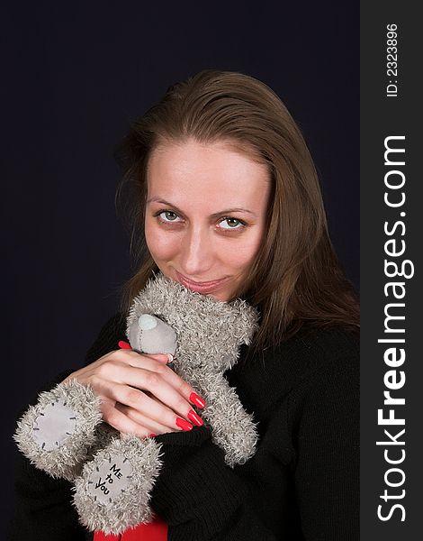 Girl with the teddy bear  ower dark. Girl with the teddy bear  ower dark