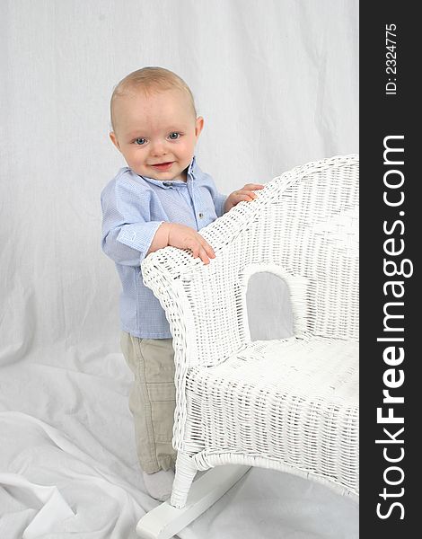 Cute little boy smiling on a white background