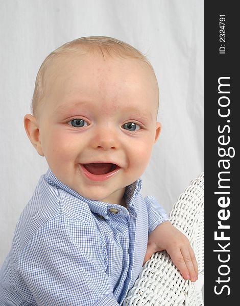 Cute little boy smiling on a white background