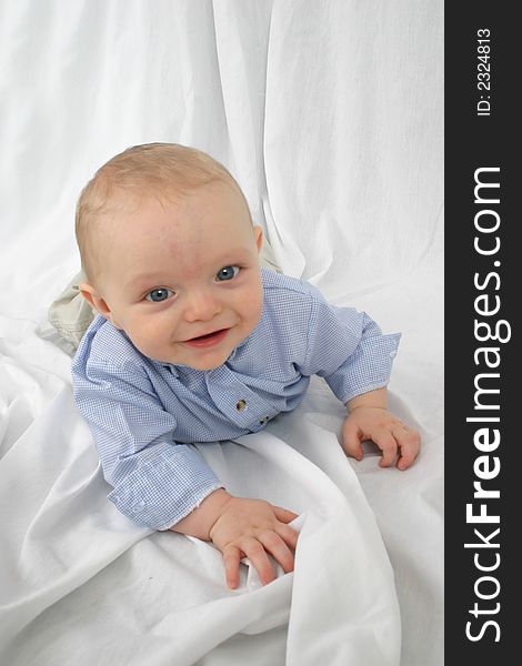 Cute little boy smiling on a white background