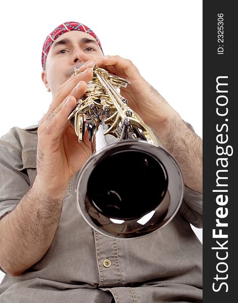 A man playing his wind instrument with expression. A man playing his wind instrument with expression.