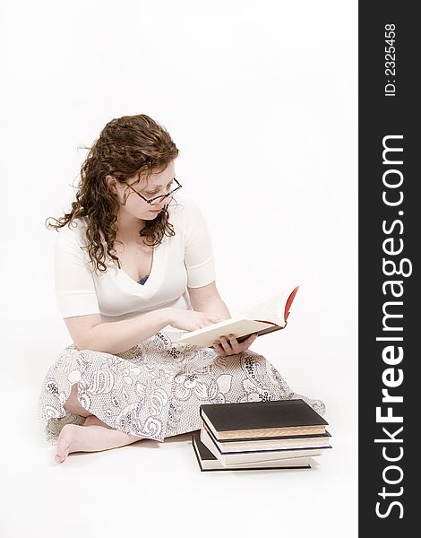 A beautiful young woman studying her books. A beautiful young woman studying her books