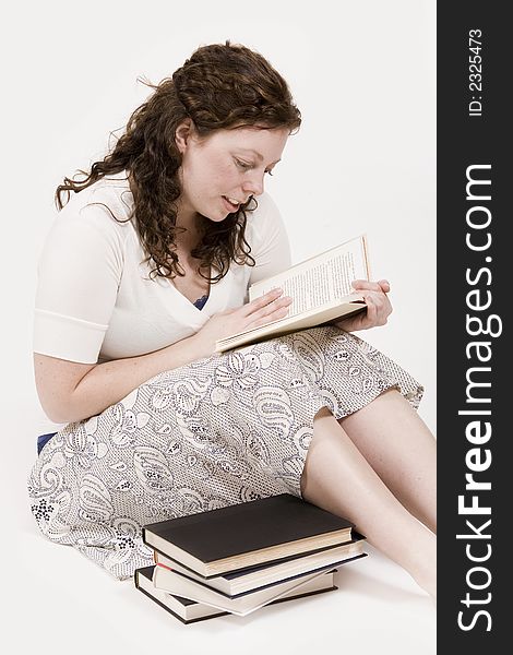 A beautiful young woman studying her books. A beautiful young woman studying her books