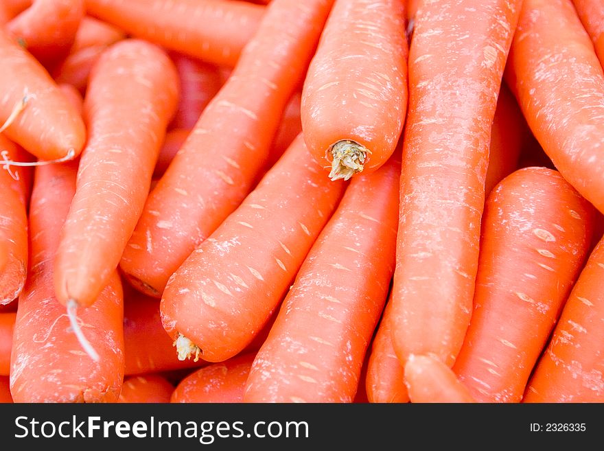 A pile of orange carrots. A pile of orange carrots