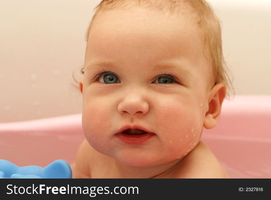 The little child taking a bath close-up