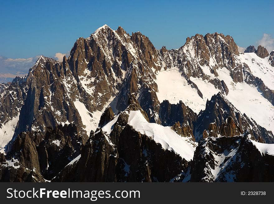 Aiguille Verte peak, in foreground Aiguille du Plan, Chamonix, Mont Blanc, West Alps, France, europe. Aiguille Verte peak, in foreground Aiguille du Plan, Chamonix, Mont Blanc, West Alps, France, europe