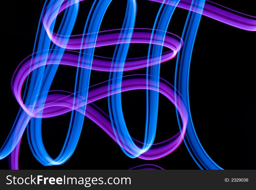 Some colrful LED lights in motion resembling ribbons. Some colrful LED lights in motion resembling ribbons