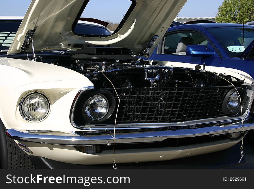 1969 white Ford Mustang front end, shaker hood scoop, 428 Cobra Jet engine. 1969 white Ford Mustang front end, shaker hood scoop, 428 Cobra Jet engine.