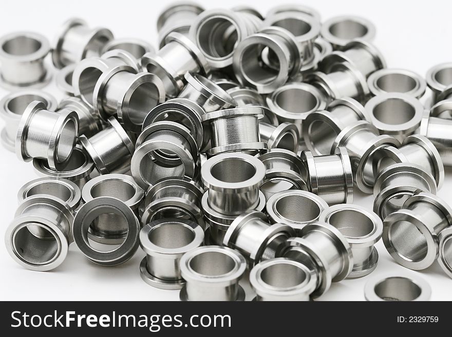 A big pile of on flesh tunnels. These are used in stretched ear lobes. A big pile of on flesh tunnels. These are used in stretched ear lobes.