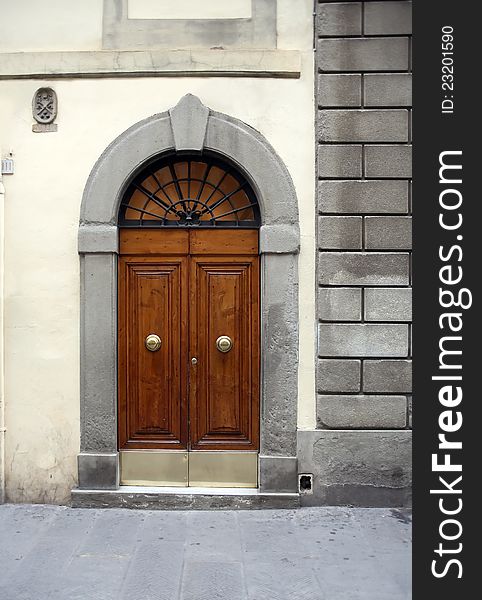 Fragment of old stone building with nice wooden door. Fragment of old stone building with nice wooden door