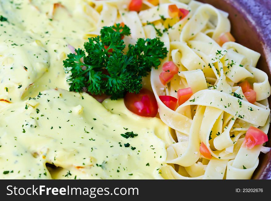 Tagliatelle pasta with cream sauce and tomato. Tagliatelle pasta with cream sauce and tomato