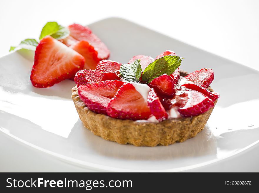 Photograph of a tasty strawberry pie on a plate