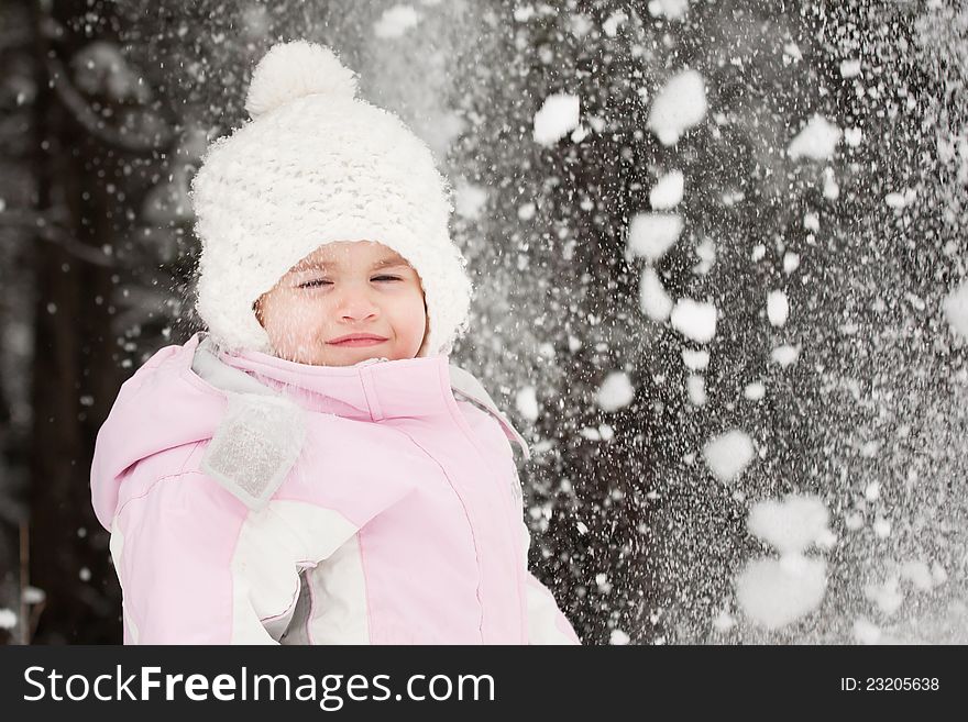 Little girl playing in the snow. Little girl playing in the snow