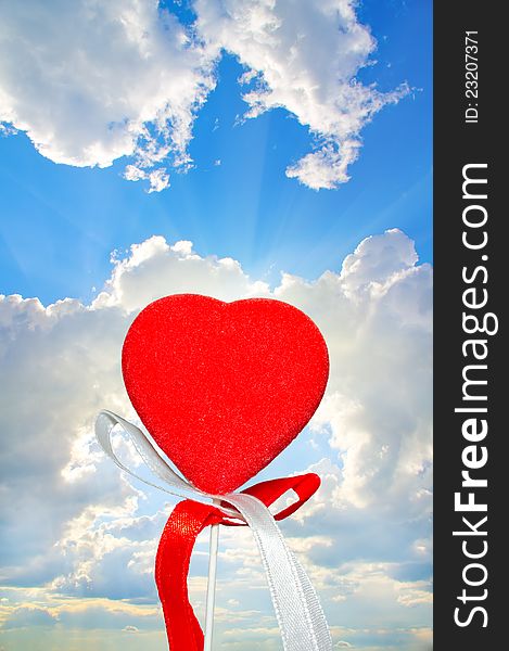 Lonely heart on blue sky background