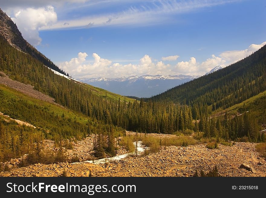 Stream flowing at the foot of the mountains in Subwatcha canyon, Canada. Stream flowing at the foot of the mountains in Subwatcha canyon, Canada