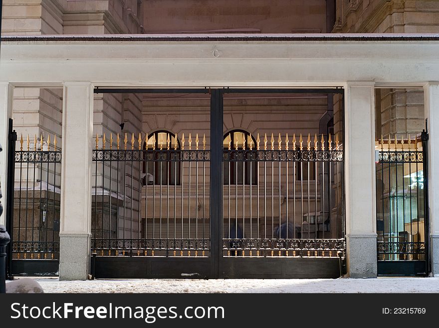 Imposing locked gates at night time. Imposing locked gates at night time