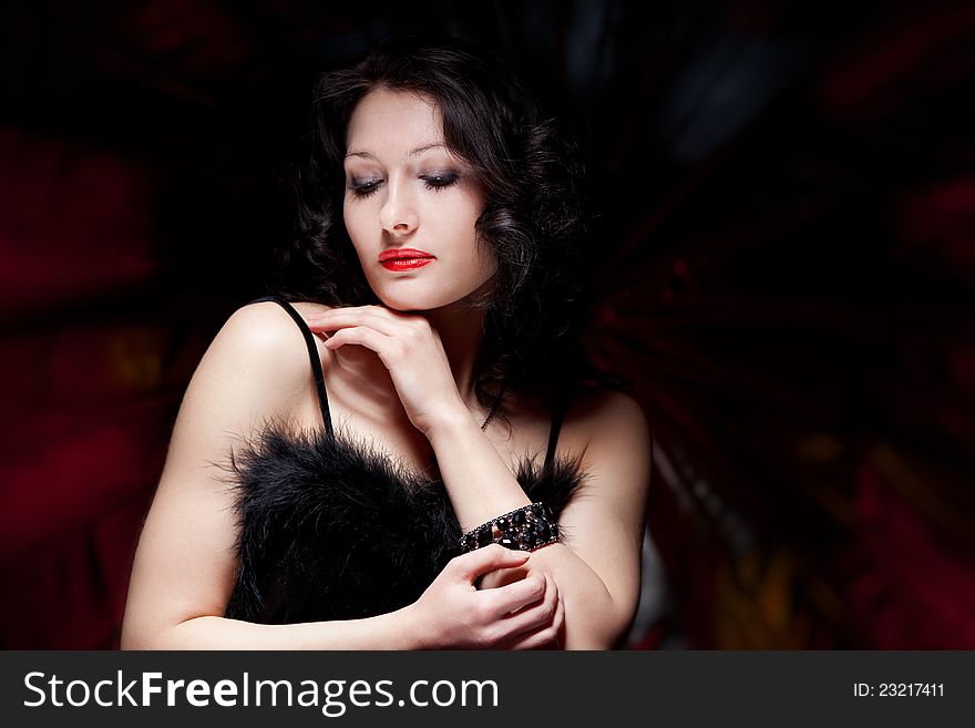 Portrait of a beautiful woman on a dark background