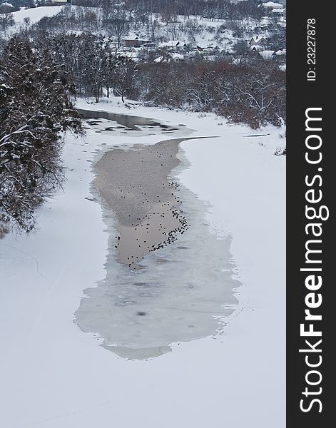 Winter landscape with frozen river and forest. Winter landscape with frozen river and forest