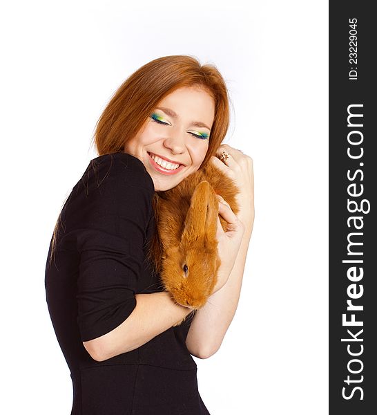 Portrait of a young beautiful woman with foxy hair