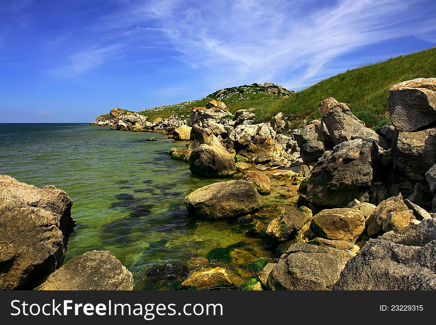 The sea shore with stones. The sea shore with stones