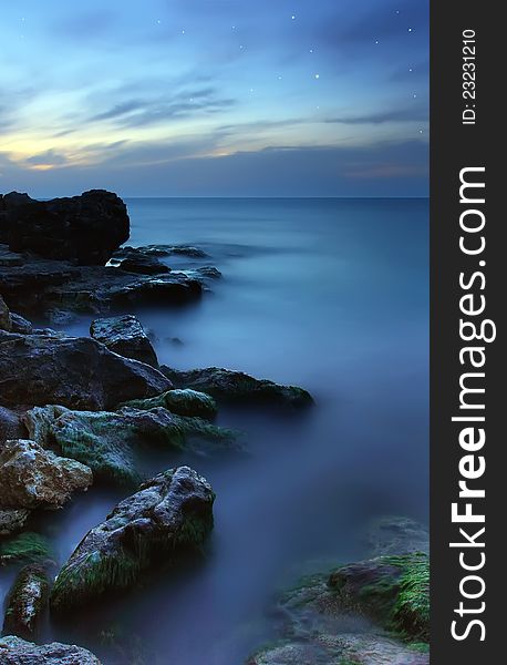 Beautiful nightly sea beach with starry sky