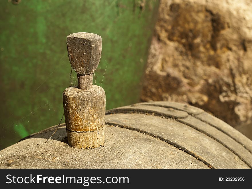 Stopper in an old wine barrel with cobwebs and dust. Stopper in an old wine barrel with cobwebs and dust