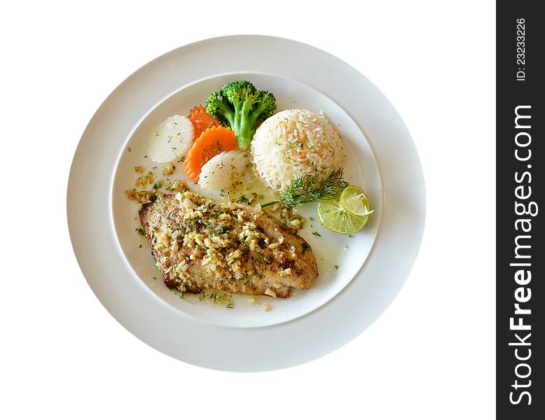 Roasted fish served with fried rice. Roasted fish served with fried rice